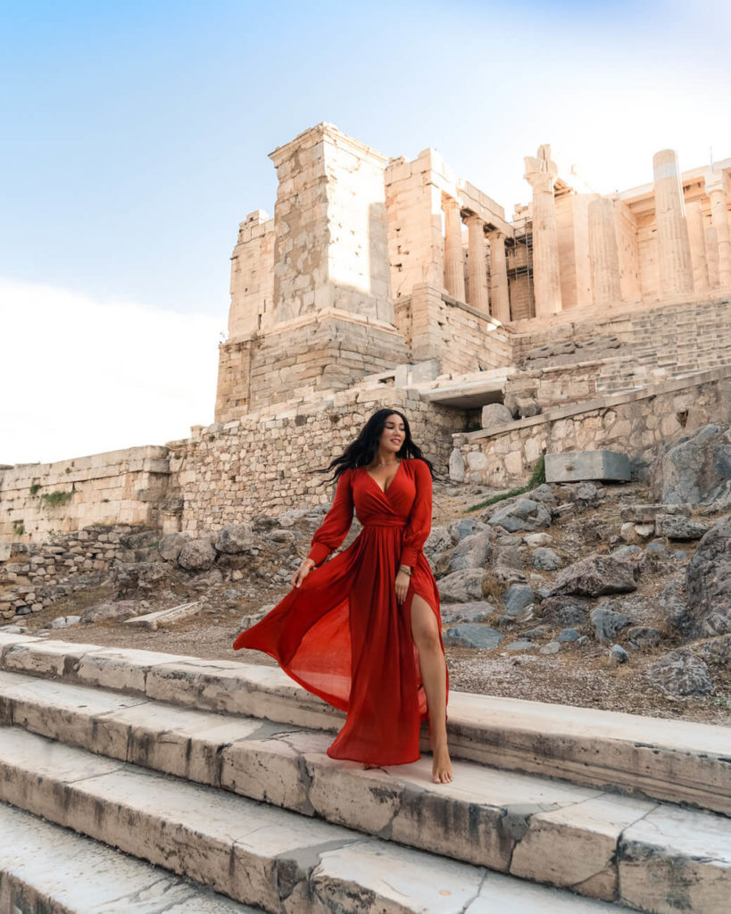 Isabella in red dress at the Temple of Olympian Zeus, Athens