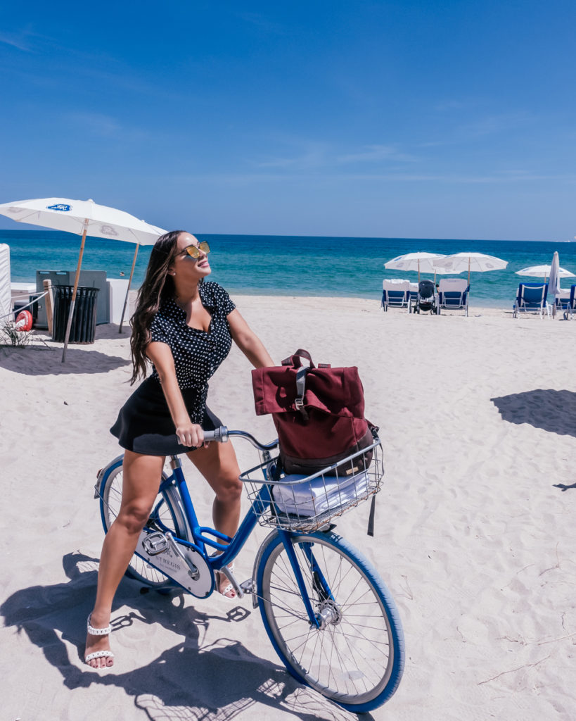 Isabella on a bicycle at the beach