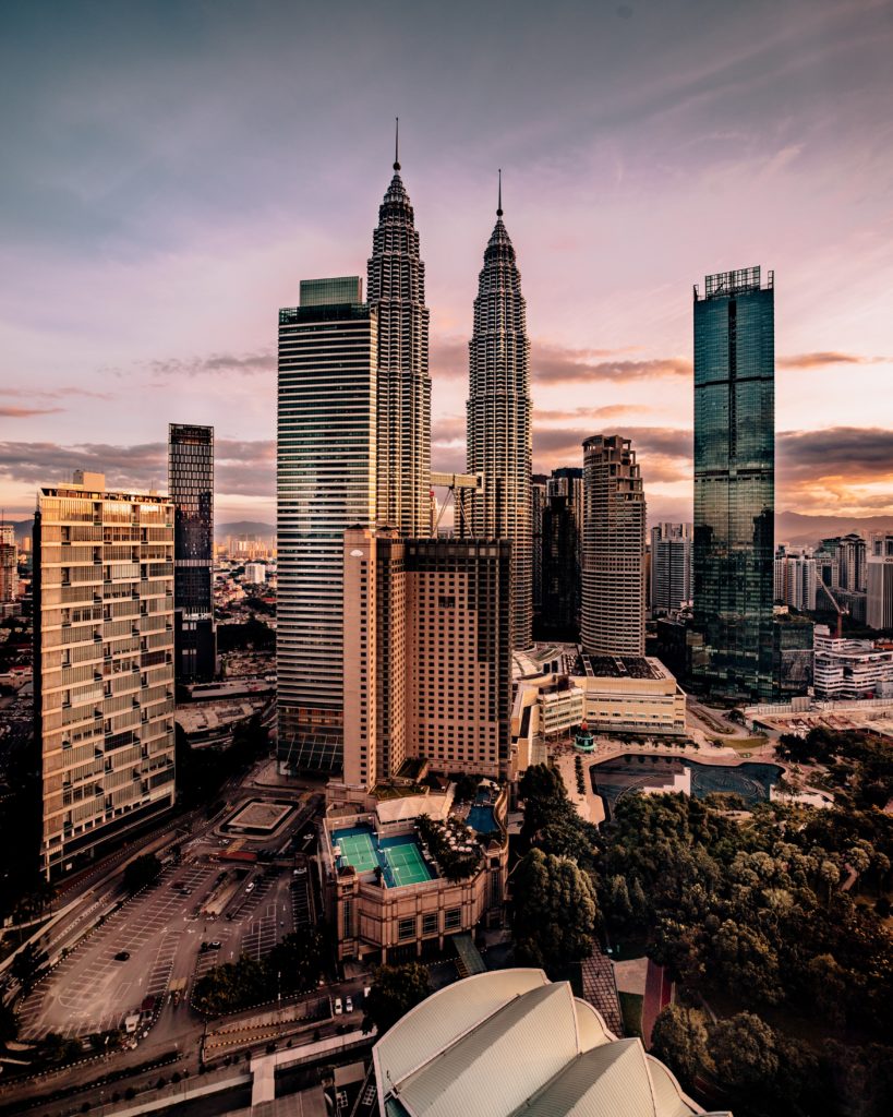 Petronas Twin towers and surrounding buildings in Kuala Lumpur, Malaysia