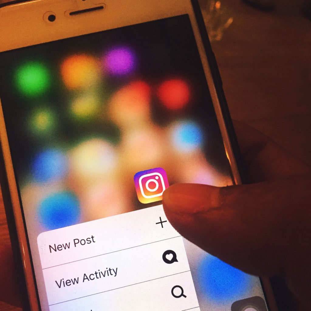 iPhone with Instagram options menu 