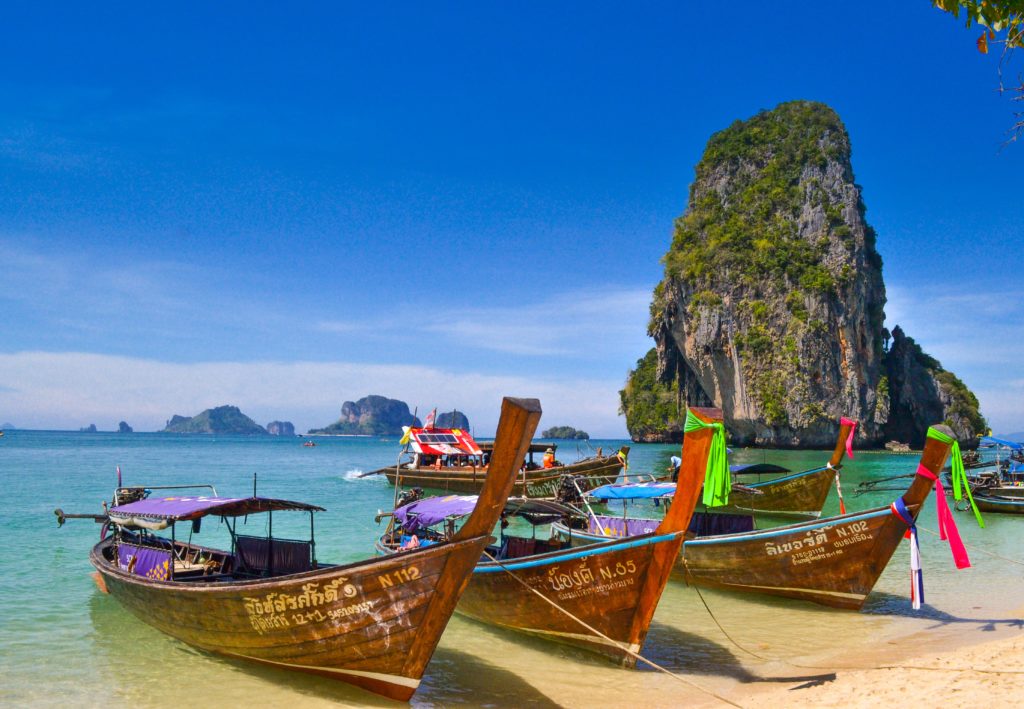 Beach in Thailand with boats on the shore