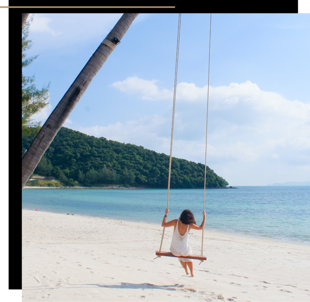 Woman on a swing on the beach at Koh Samui, Thailand