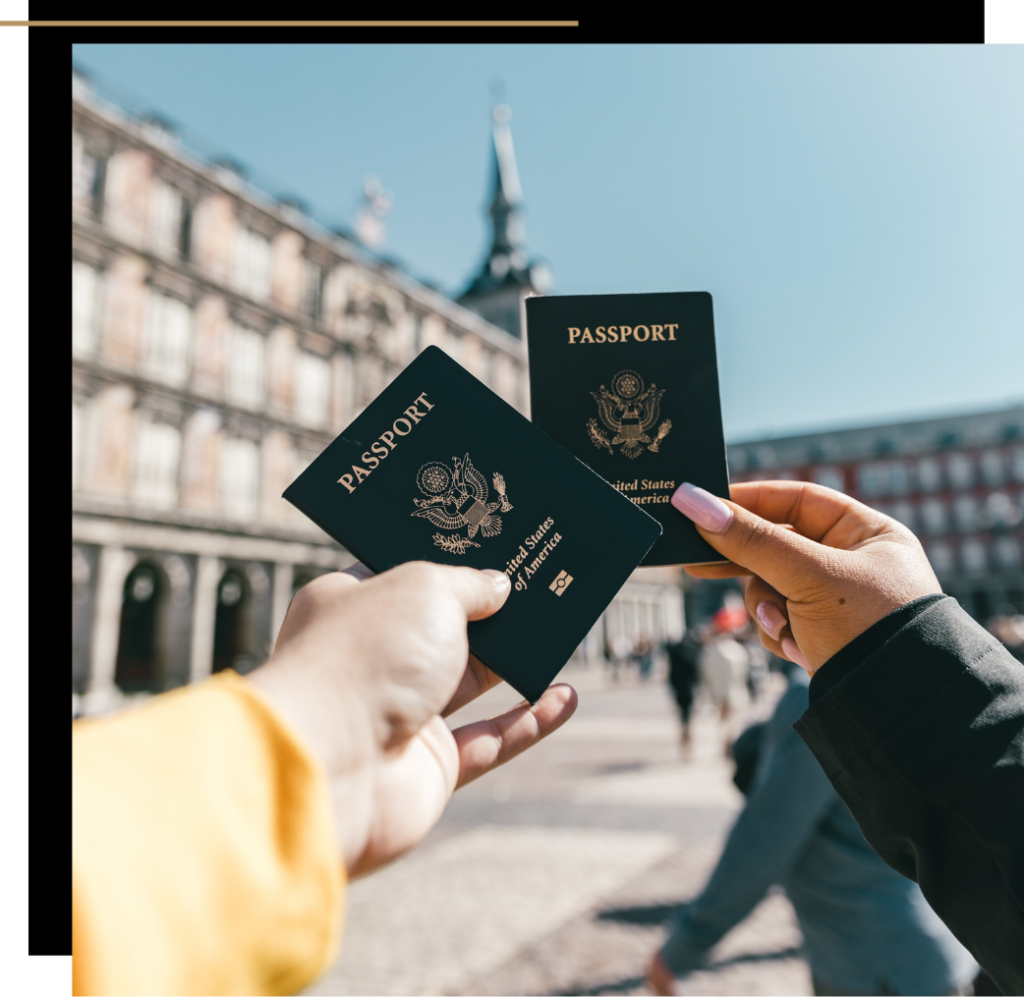 two people holding up passports
