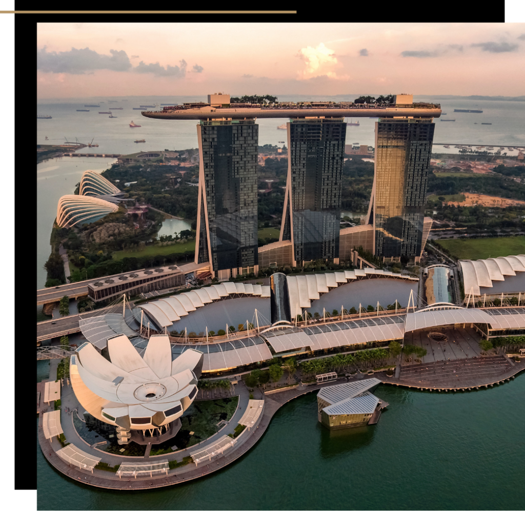 Aerial view of Marina Bay Sands and Gardens by the Bay at sunset