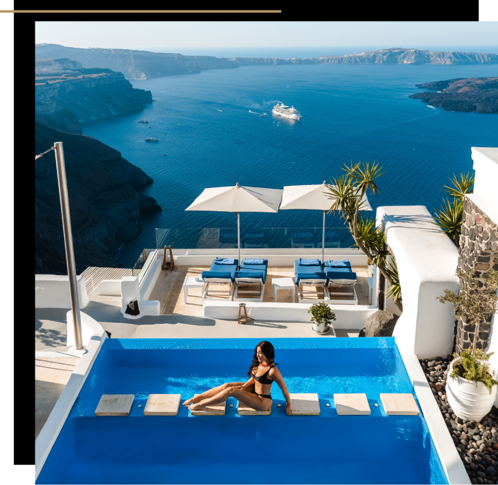 Isabella sitting on stepping stones across an infinity pool in Santorini, Greece