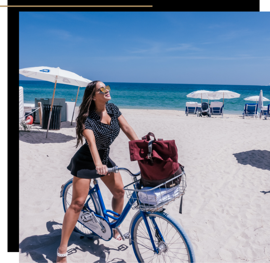 Isabella on a bicycle on the beach in Miami