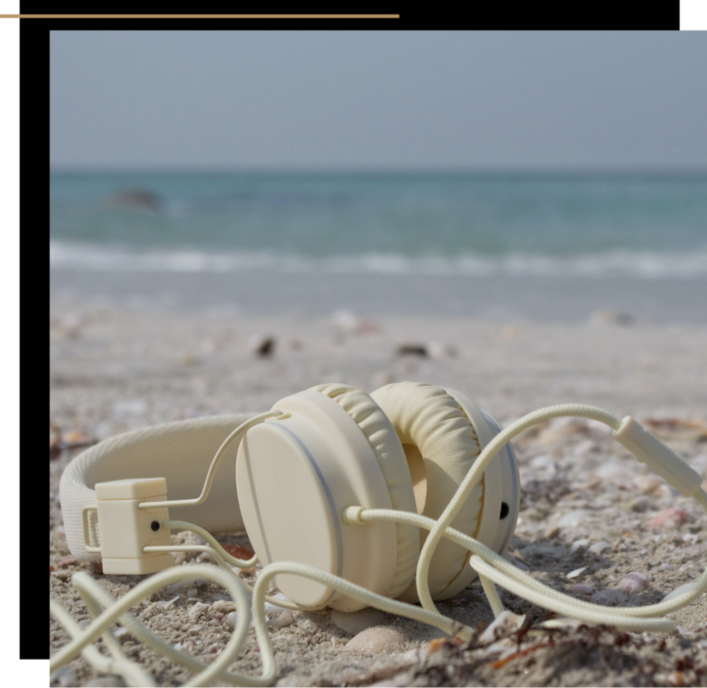 White headphones on the beach