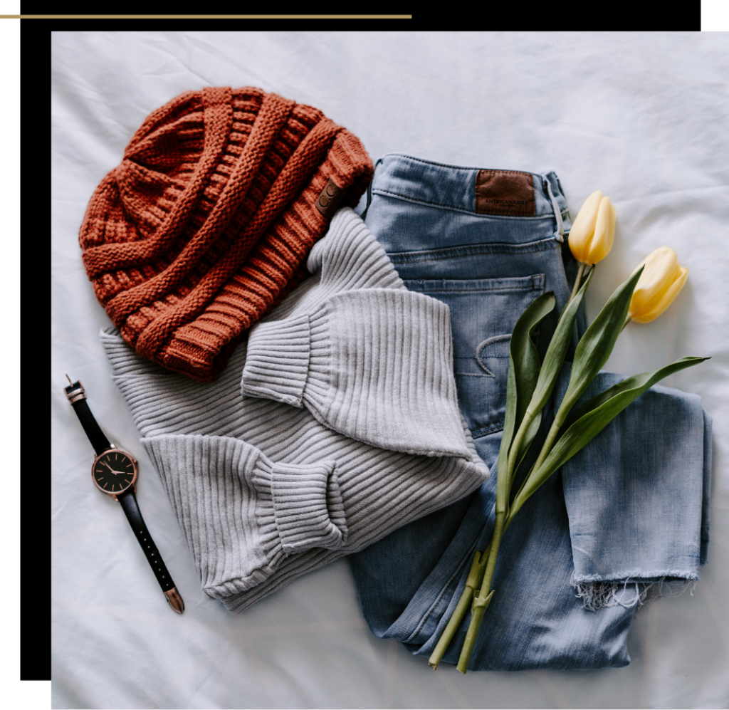 An assortment of clothes with some yellow tulips 