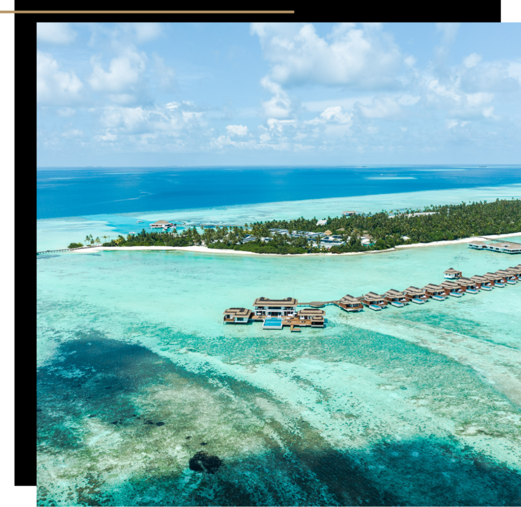 The overwater villas and jetty at the Pullman Maldives Maamutaa, one of the best luxury resorts in The Maldives