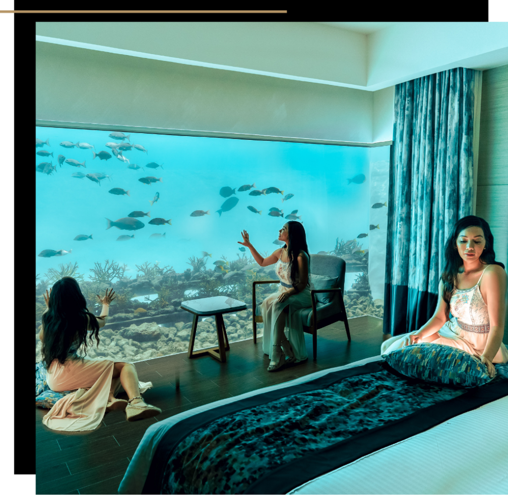 Multiple versions of Isabella in the underwater suite at Pullman Maldives Maamutaa 