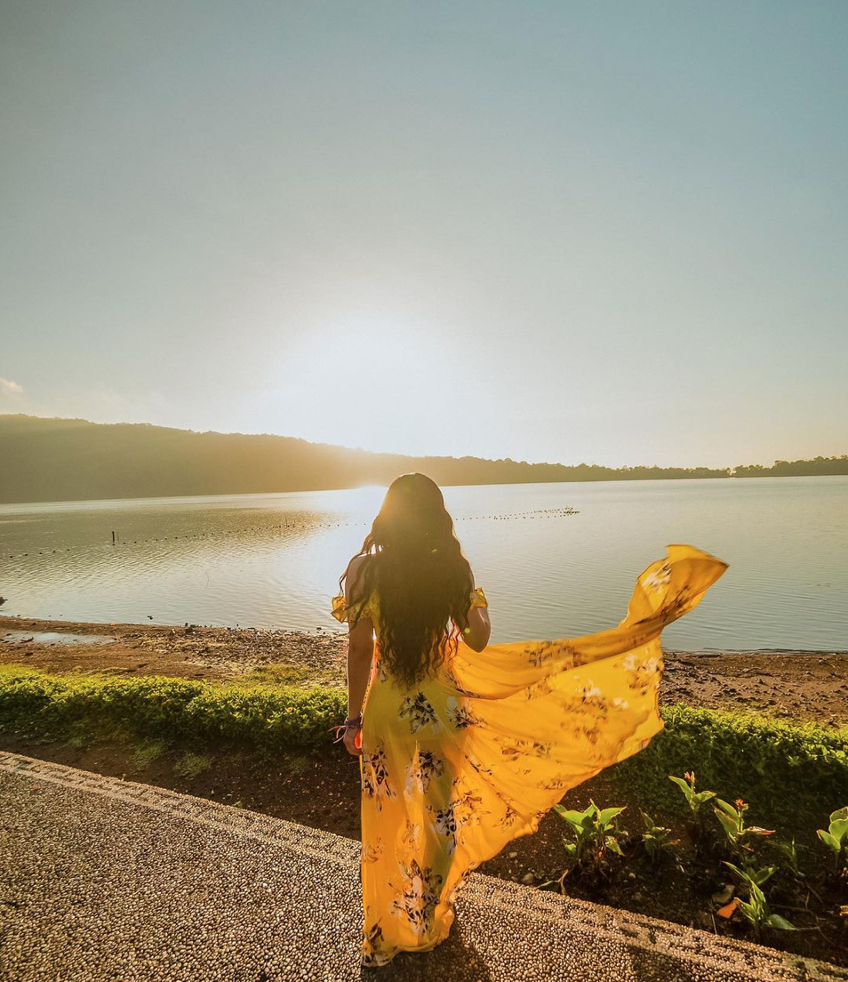 Isabella in a yellow dress at sunset
